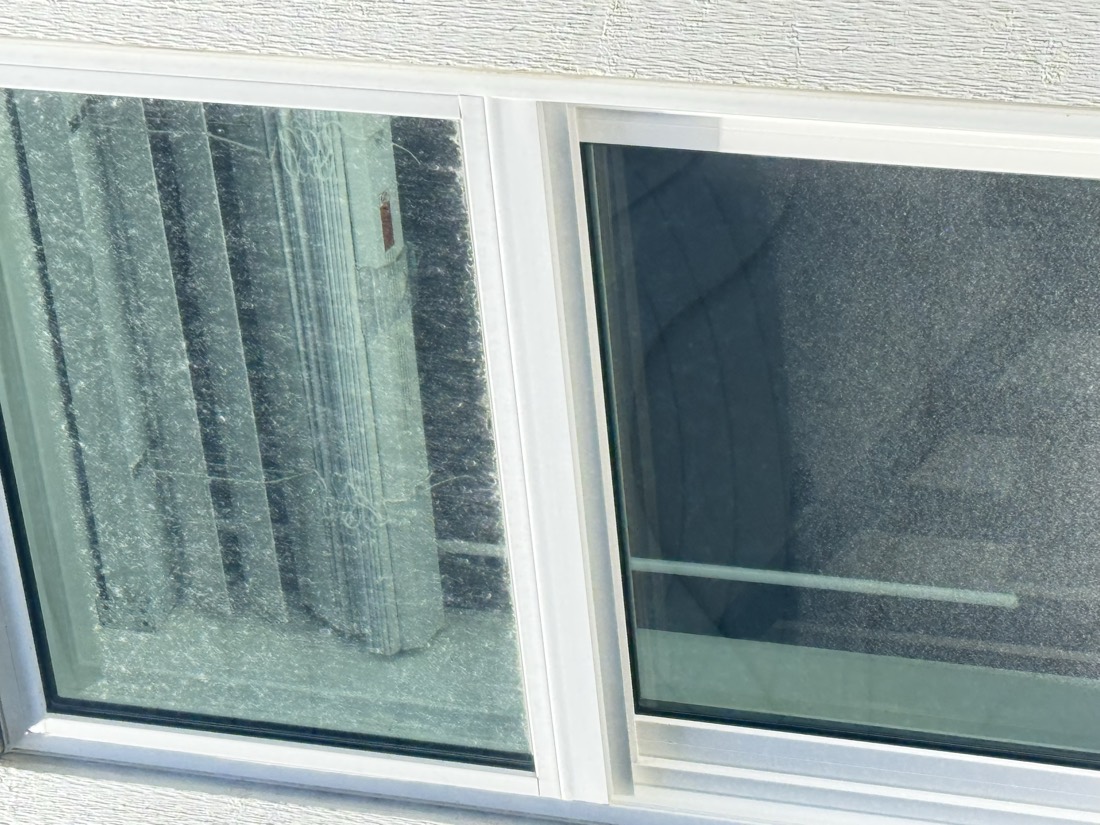Cobwebs and grime on glass before window cleaning