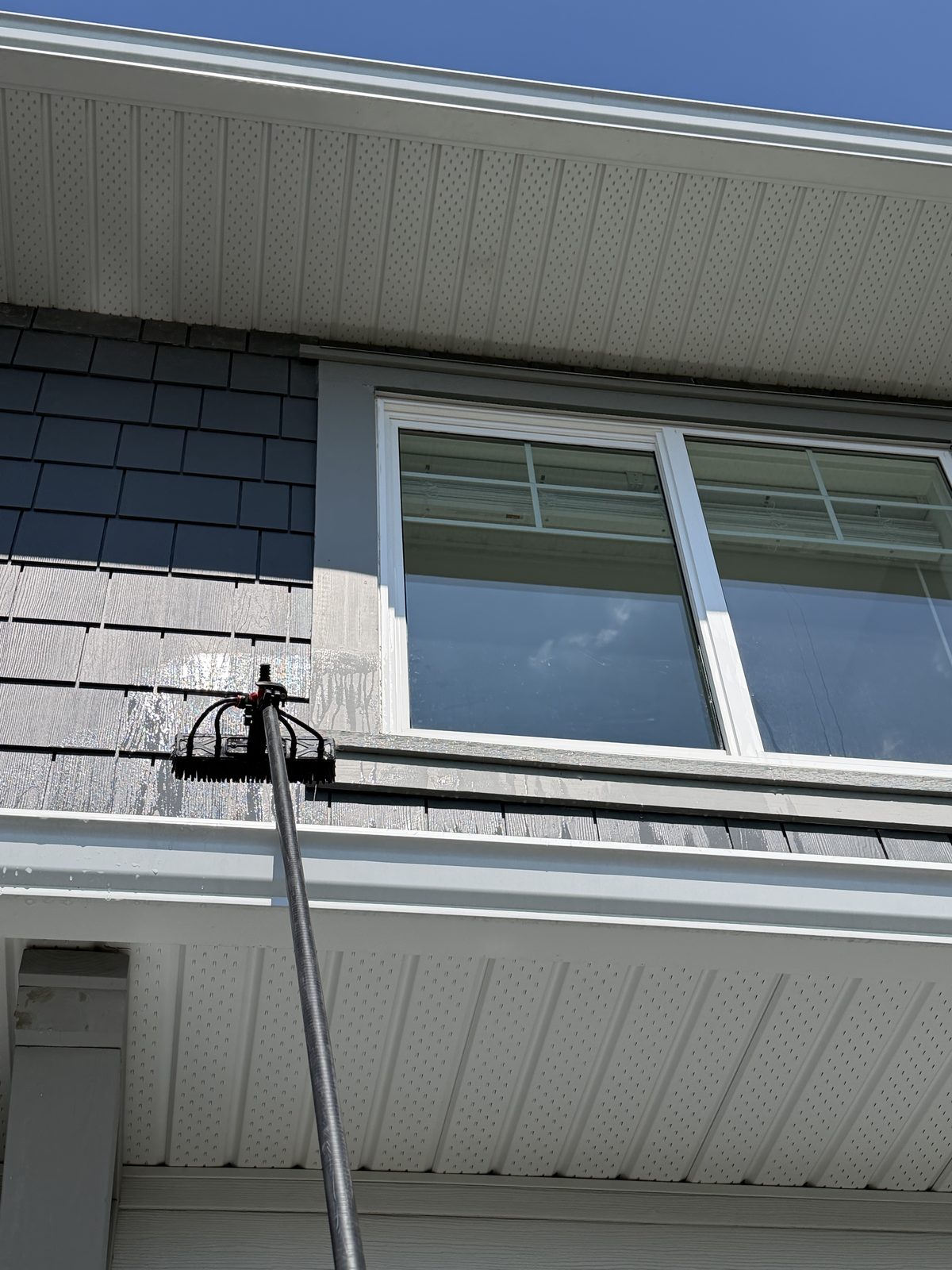 Pure water rinse sheeting off upper windows — dries spot-free with no soap film